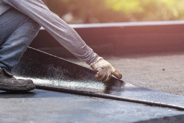 Professional Basement Waterproofing technician working in Rensselaer, NY